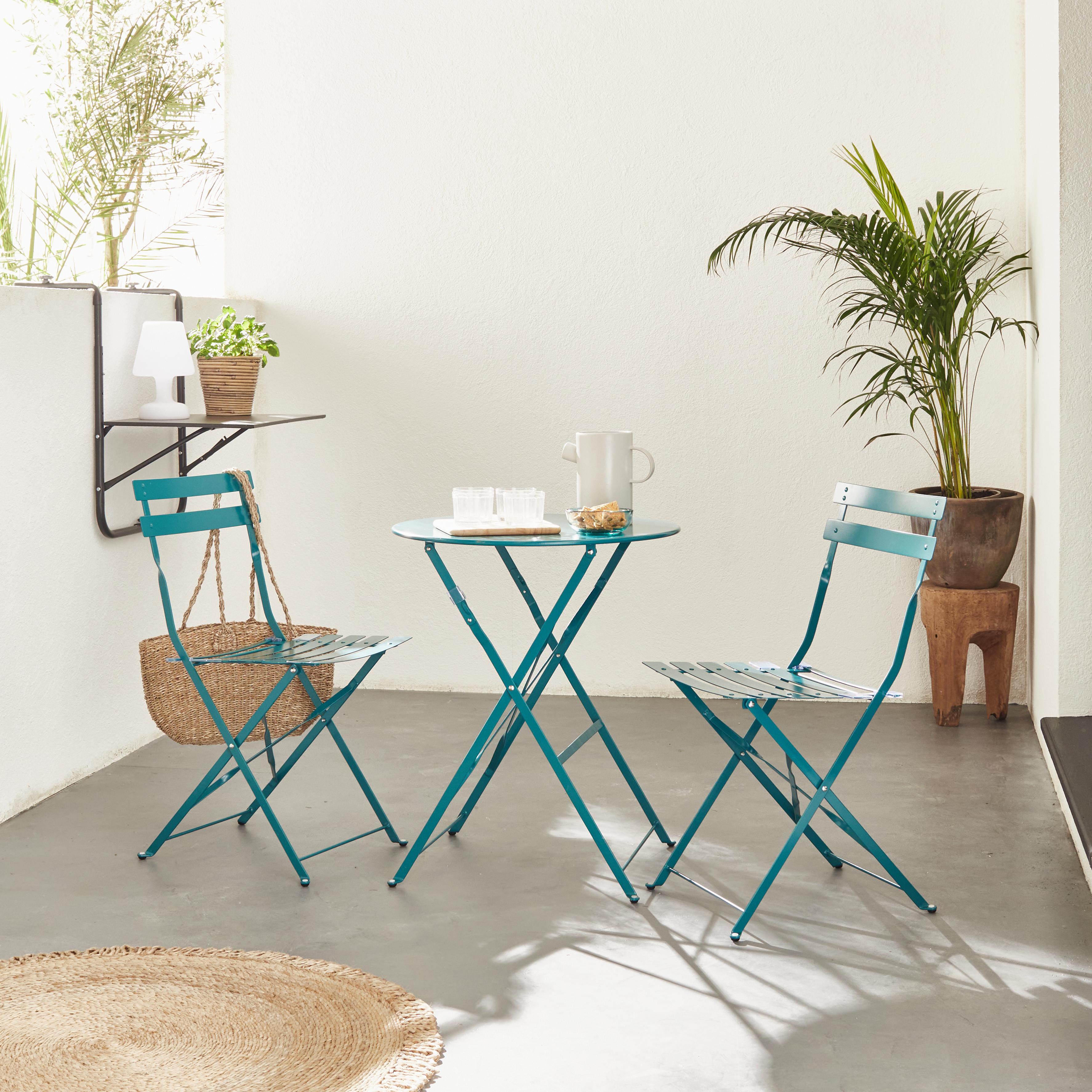 EMILIA bistroset - 2 inklapbare stoelen en een ronde tafel van gepoedercoat  staal met matte afwerking – donker turquoise